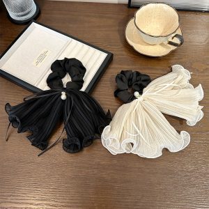 pleated bow hair tie, pearl bow hair tie, cream bow hair tie, black bow hair tie, pleated hair bow, pearl detail hair tie, elegant hair accessory, cute bow hair tie, women’s hair ties, girls bow hair tie, stylish ponytail accessory, pleated bow uk, pleated bow aldershot, pleated bow london, bow hair tie, pearl hair accessory